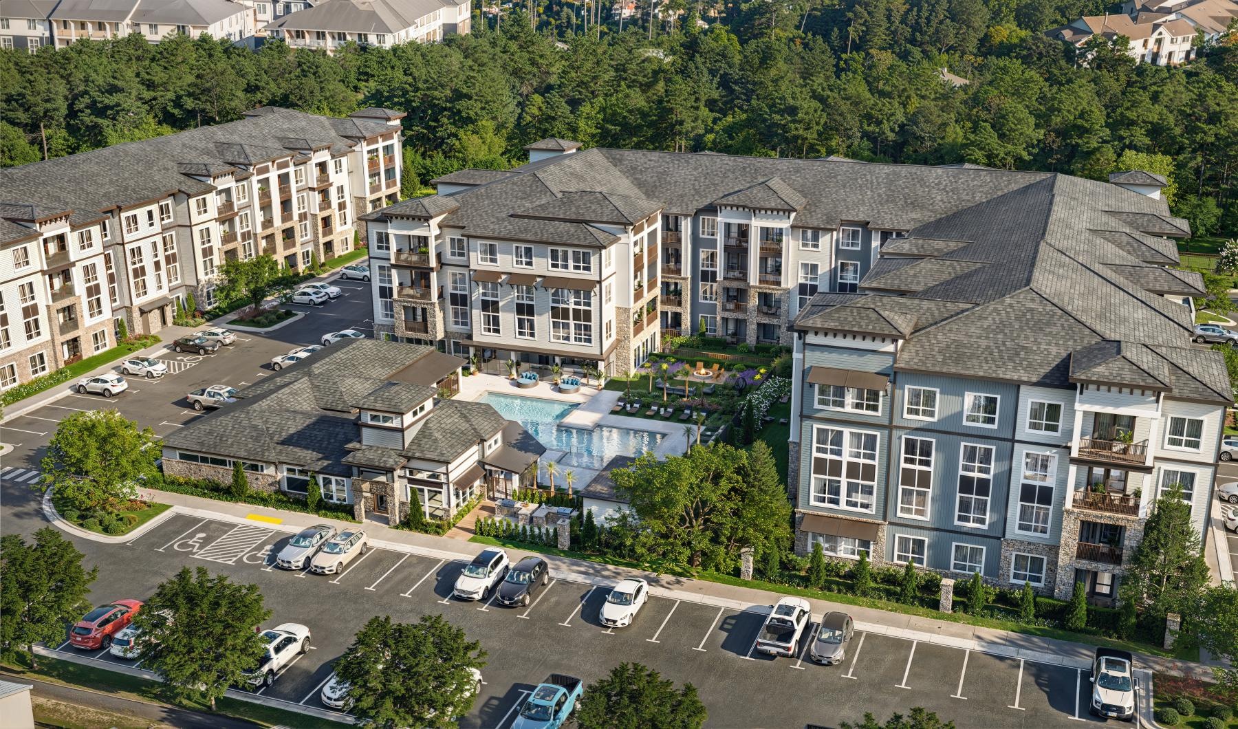 a group of buildings with cars parked in front of them